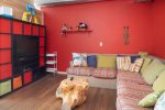 Garage with Seating and Entertainment Area